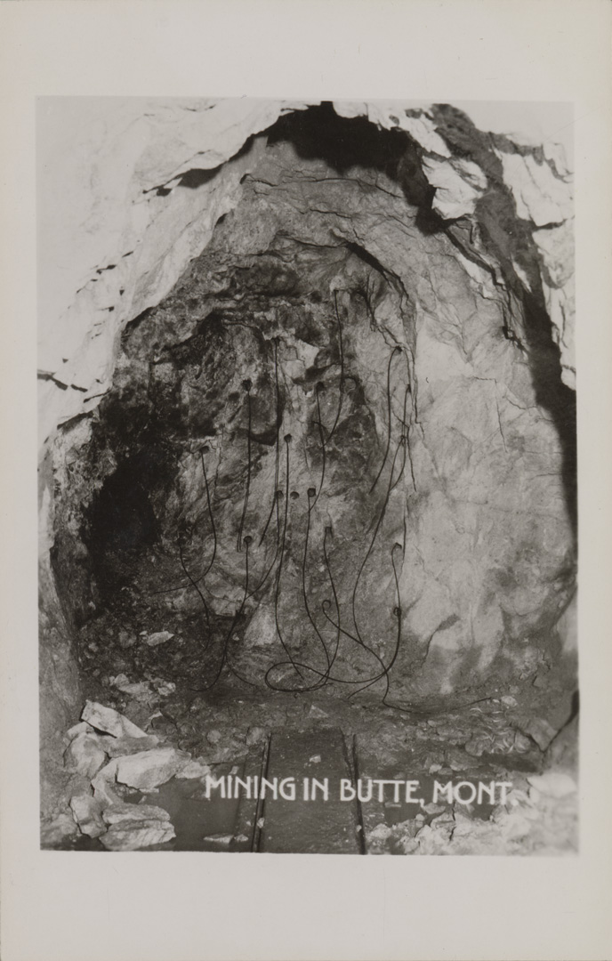 Mining in Butte, Montana. Dynamite holes with fuses.